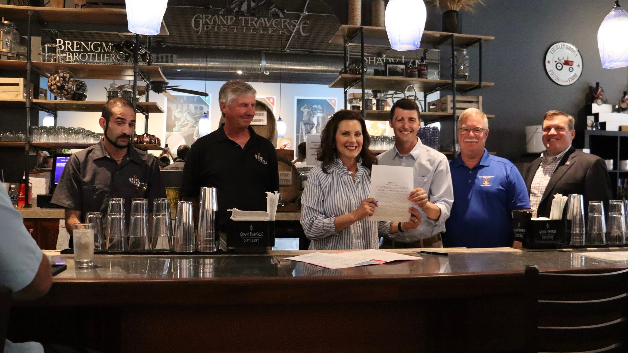Whitmer signs bill to cut costs for Michigan's craft distilleries, help the state's grain farmers