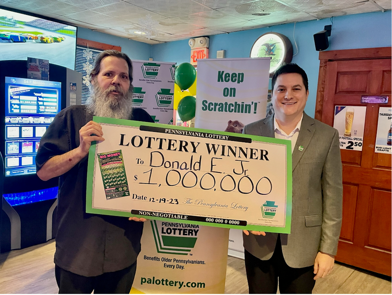 Pictured left to right: Donald Eller Jr. of Cambria County, Pennsylvania Lottery Assistant Western Regional Sales Manager Allen Zieglar