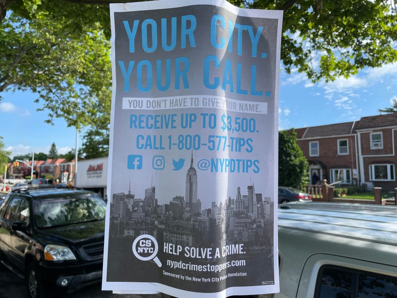 An NYPD Crime Stoppers poster near the scene of Tuesday night's shooting in St. Albans