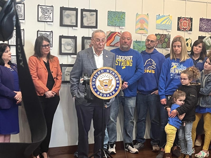 Senator Schumer standing with Lockport Mayor Michelle Roman, concerned parents and teachers at Lockport High School. (4/5/23). 