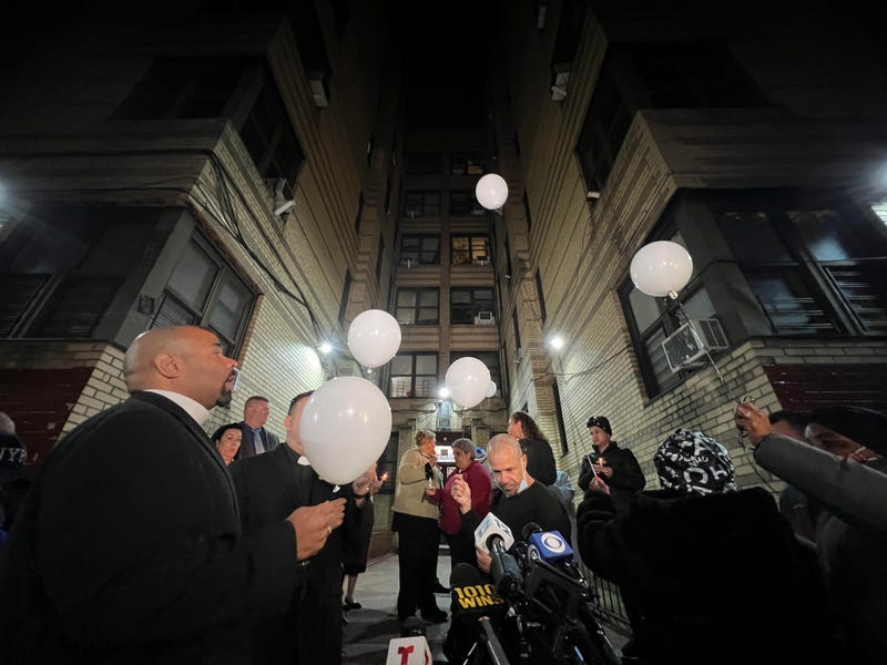 Vigil attendees release balloons Wednesday night in honor of the two twin boys who were found dead in a Bronx building's back alley on Nov, 9, 2020.