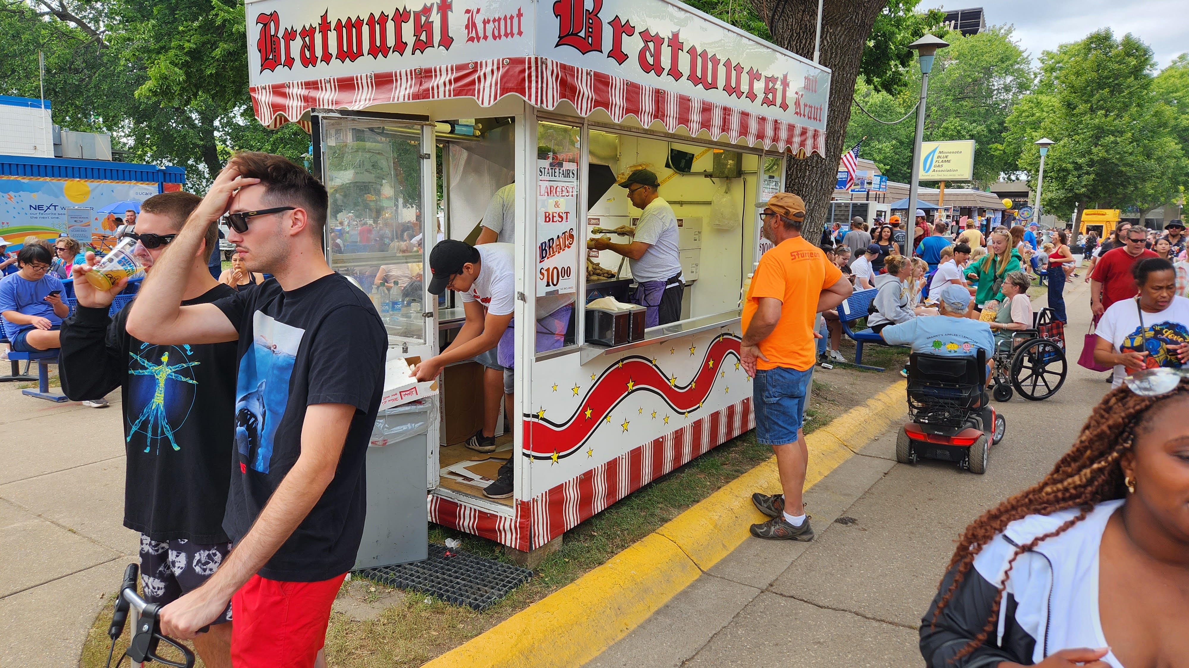 Hiding in plain sight; brat stand in middle of State Fair's busiest intersection gets you in and out fast