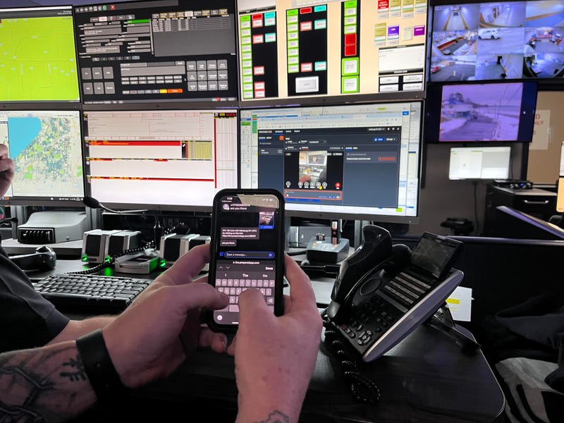 Hamburg's Emergency Manager Sean Crotty demonstrates the text feature that dispatch can use to to send messages non-verbally to the 911 caller.
