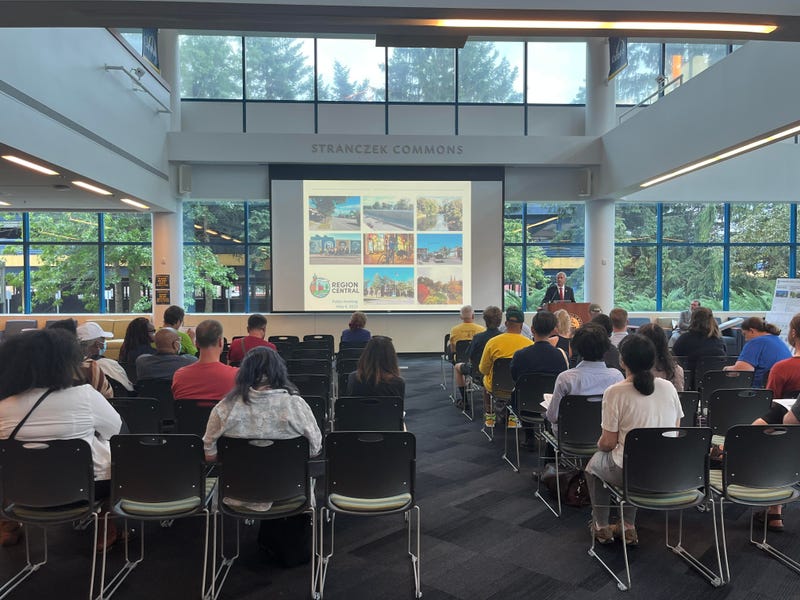 New York State Senator Sean Ryan at the podium, addressing the Scajaquada reimaging project at Canisius college.