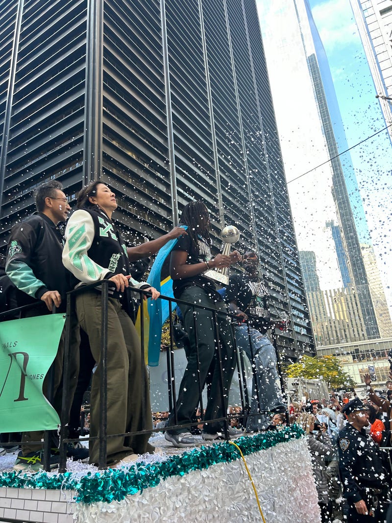 Confetti falls on the New York Liberty at the parade