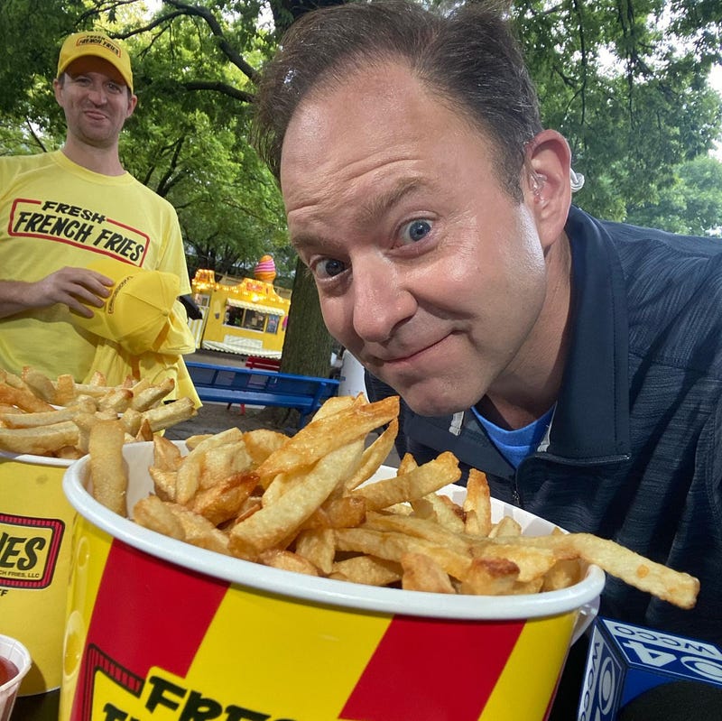 Jason DeRusha and a bucket of of Fresh French Fries at the Minnesota State Fair.