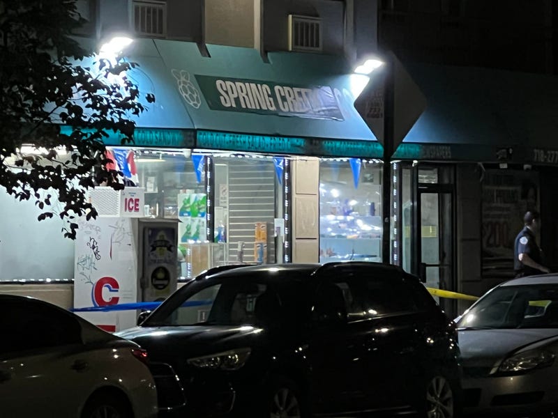 Crime scene tape was up outside the deli, where two men were fatally shot