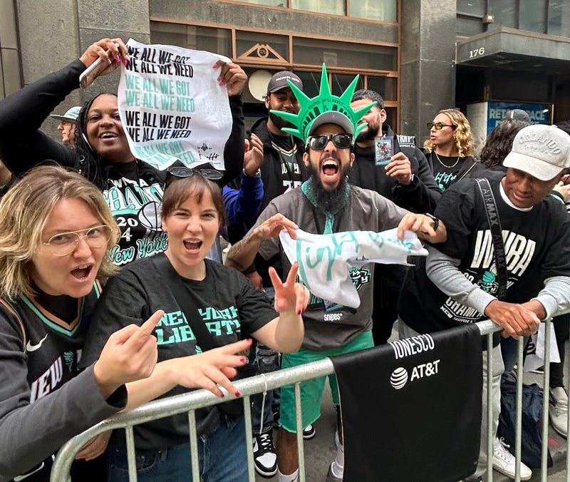 Liberty fans celebrate along the parade route