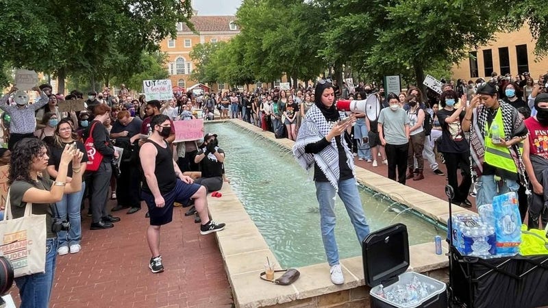 A student leads a protest on the University of North Texas campus in Denton, Texas, on Tuesday, April 30, 2024.