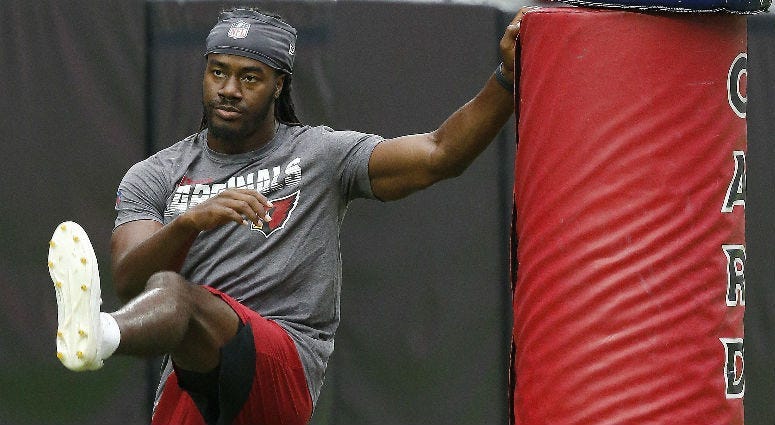 Arizona Cardinals defensive back Josh Shaw stretches before running sprints during preseason training on Wednesday, July 24, 2019.