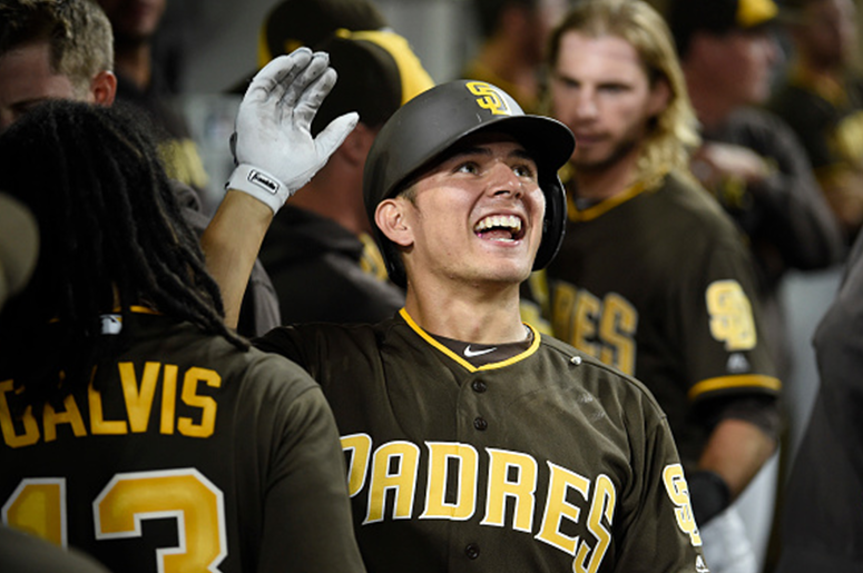 AUGUST 31: Luis Urias #9 of the San Diego Padres is congratulated after hitting a two-run home run during the eighth inning of a baseball game against the Colorado Rockies at PETCO Park on August 31, 2018 in San Diego, California. (Photo by Denis Poroy/Ge