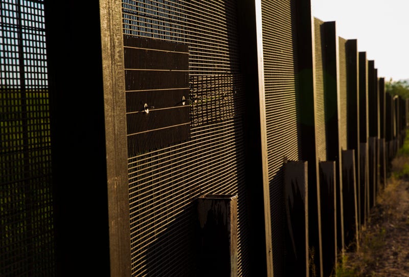 The mesh fence is patched where drug smugglers cut it open and drove a vehicle o
