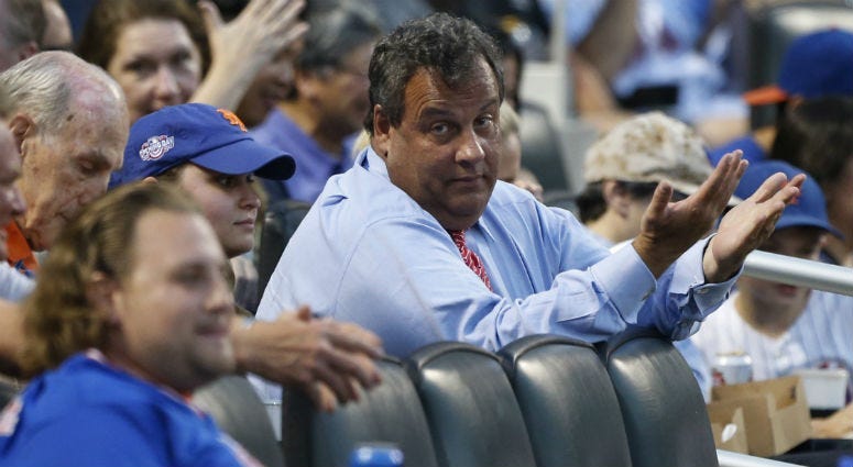 Former New Jersey Governor Chris Christie reacts after a ball went into the stands near him in the third inning of game between the St. Louis Cardinals and New York Mets at Citi Field. 