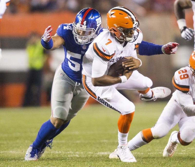 Cleveland Browns quarterback DeShone Kizer (7) is sacked by New York Giants defensive end Olivier Vernon (54) during the second quarter at FirstEnergy Stadium.