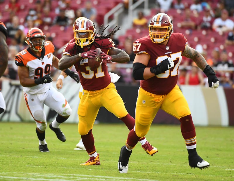 Aug 27, 2017; Landover, MD, USA; Washington Redskins running back Matt Jones (31) carries the ball as offensive guard Kyle Kalis (67) blocks against the Cincinnati Bengals during the second half at FedEx Field. Mandatory Credit: Brad Mills-USA TODAY Sport