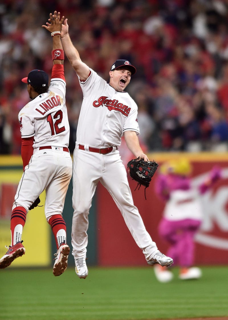 Cleveland Indians shortstop Francisco Lindor (12) and right fielder Jay Bruce (32) celebrates after beating the New York Yankees in game one of the 2017 ALDS at Progressive Field.