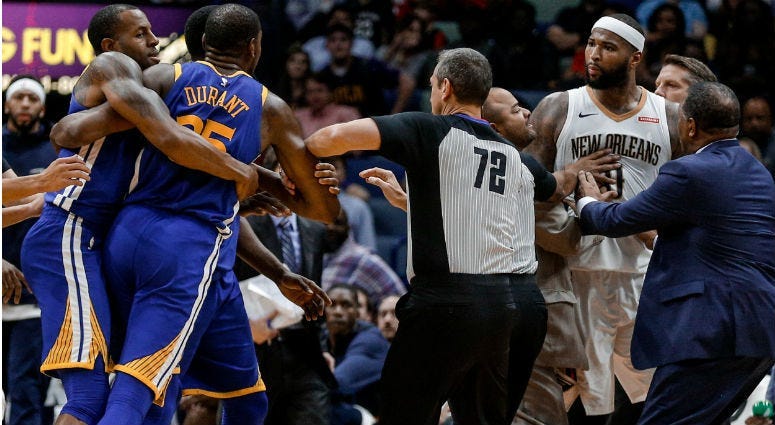 DeMarcus Cousins and Kevin Durant are held back from each other prior to both players being ejected during the fourth quarter at the Smoothie King Center in New Orleans.