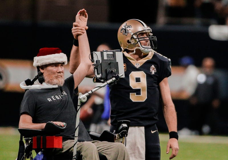 New Orleans Saints quarterback Drew Brees (9) leads the who dat chant with former player Steve Gleason 