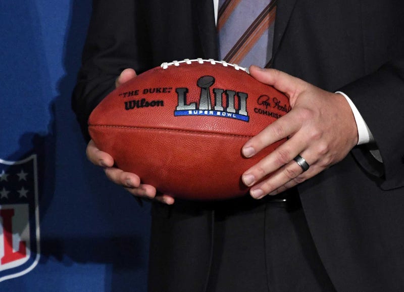 Atlanta Sports Council president Dan Corso holds a Super Bowl LIII logo football 