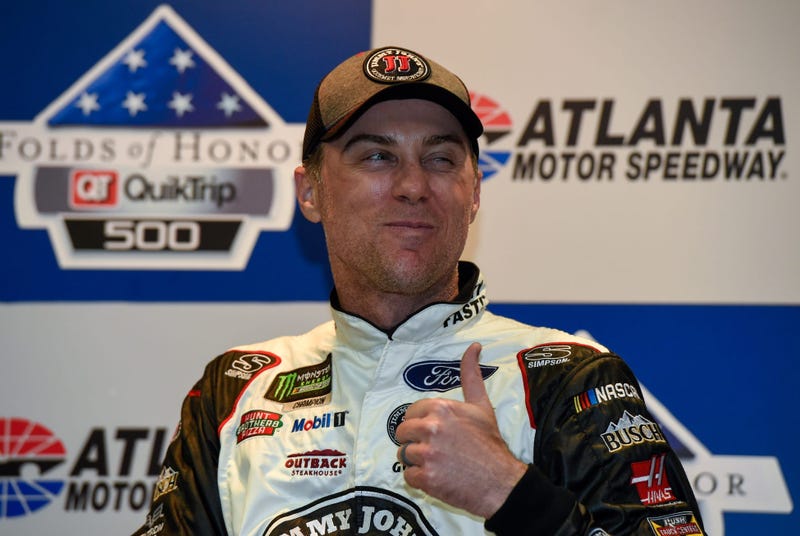 Feb 25, 2018; Hampton, GA, USA; Monster Energy NASCAR Cup Series driver Kevin Harvick (4) reacts to a question while talking with media after winning the Folds of Honor QuikTrip 500 at Atlanta Motor Speedway.