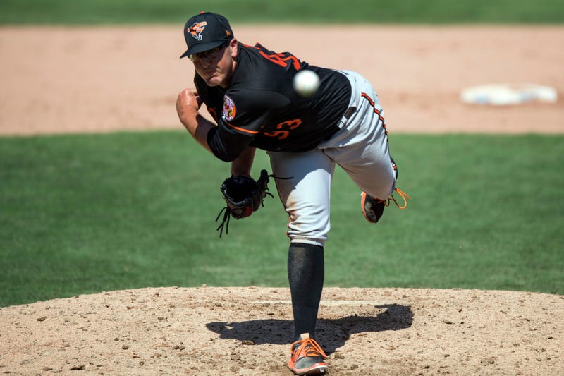 Zac Lowther tosses a pitch during Spring Training