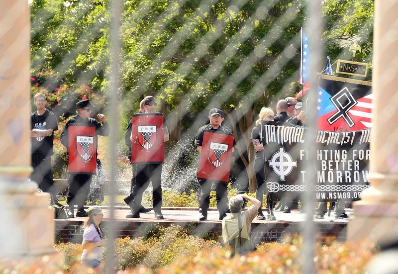 Neo-Nazis protest behind barricades