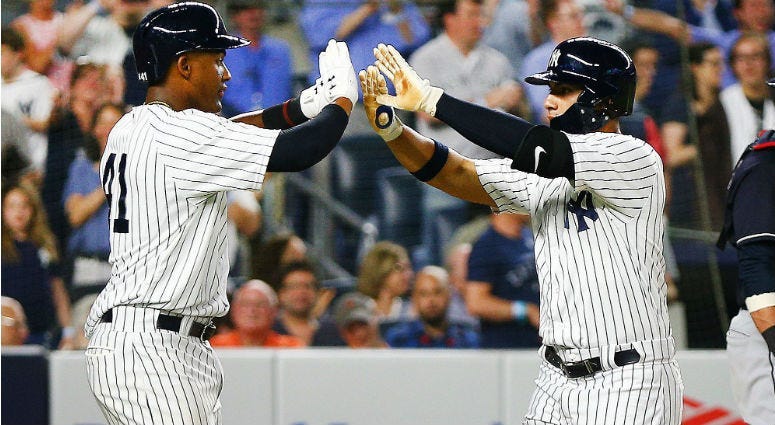 Gleyber Torres is congratulated by Miguel Andujar after hitting a three run home run. His first MLB home run against the Cleveland Indians during the fourth inning at Yankee Stadium.
