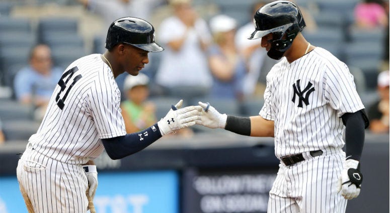 Miguel Andujar greets Gleyber Torres at home after Torres hit a home run in the ninth inning against the Baltimore Orioles at Yankee Stadium.