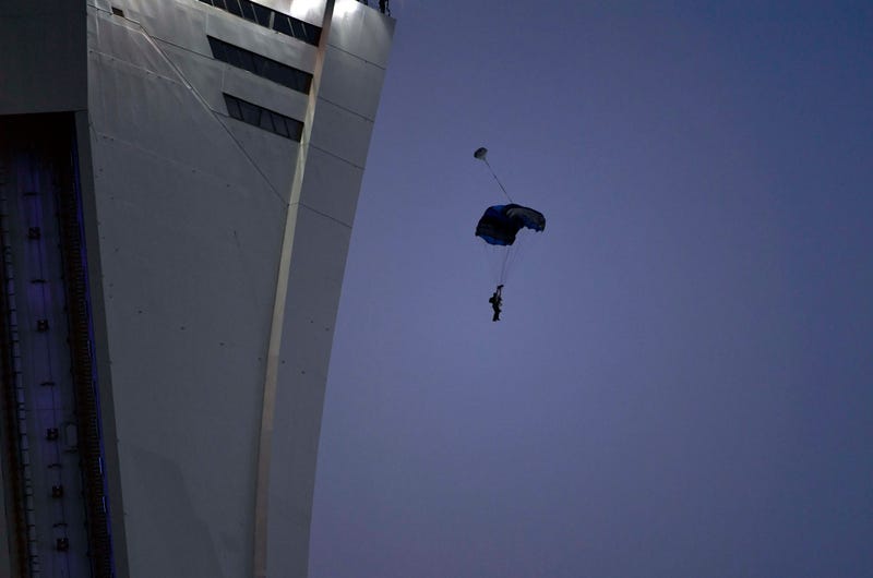Aug 18, 2018; Montreal, Quebec, CAN; A base jumper leaps from the OlyAug 18, 2018; Montrempic Stadium's tower during the first half of the game between the Chicago Fire and the Montreal Impact at Stade Saputo. Mandatory Credit: Eric Bolte-USA TODAY Sports