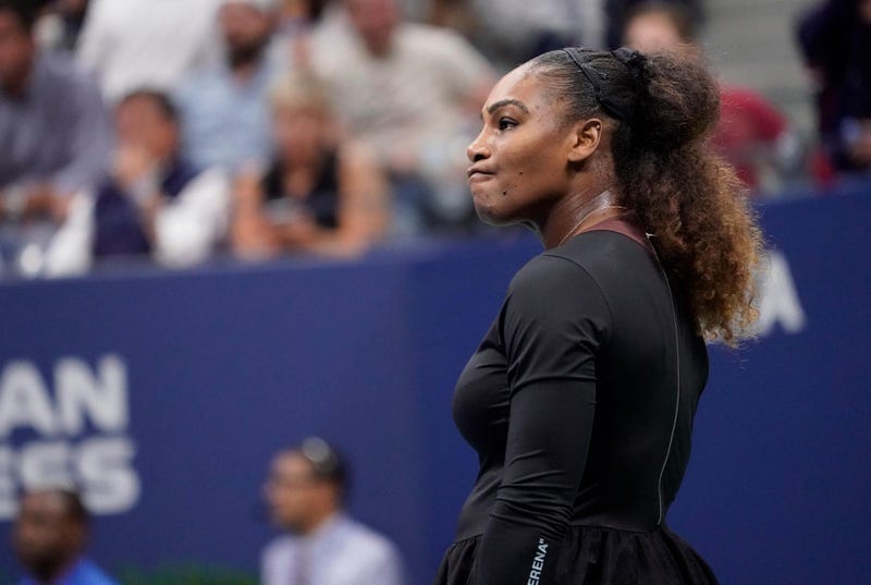 Serena Williams awaits her serve as boos rain down after an argument with officials while playing Naomi Osaka in the women's final on Sept. 8, 2018, at the U.S. Open at the USTA Billie Jean King National Tennis Center.