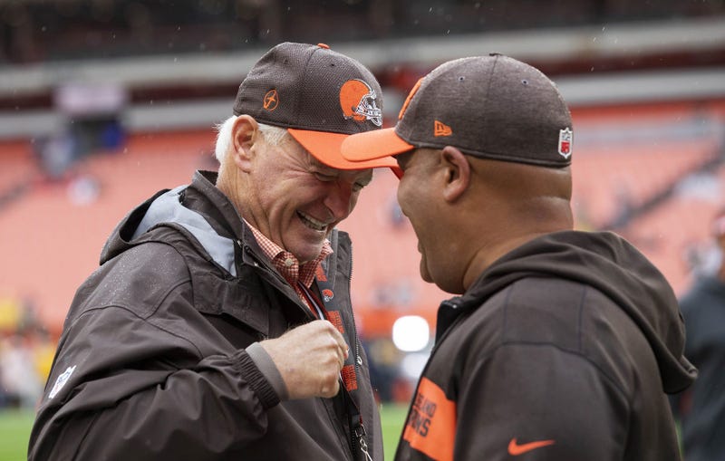 Cleveland Browns owner Jimmy Haslam, left, talks head coach Hue Jackson before the game at FirstEnergy Stadium.
