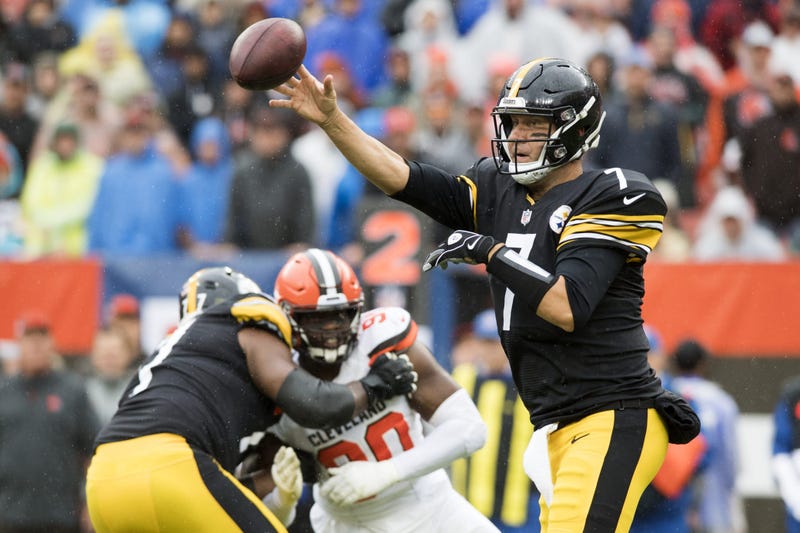 Pittsburgh Steelers quarterback Ben Roethlisberger (7) throws a pass as Cleveland Browns defensive end Emmanuel Ogbah (90) rushes during the first quarter at FirstEnergy Stadium.