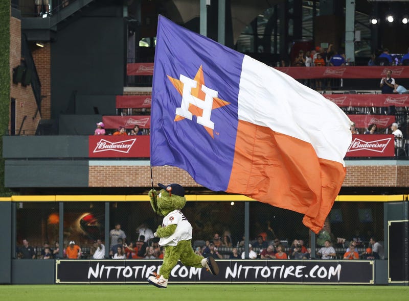 Orbit runs the Astros flag