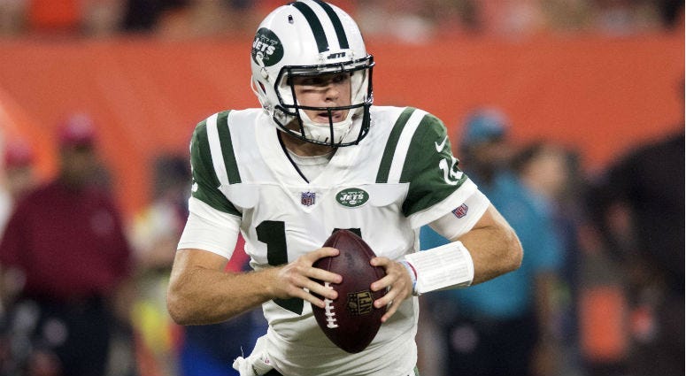 Sam Darnold rolls out to pass during the first quarter against the Cleveland Browns at FirstEnergy Stadium. 