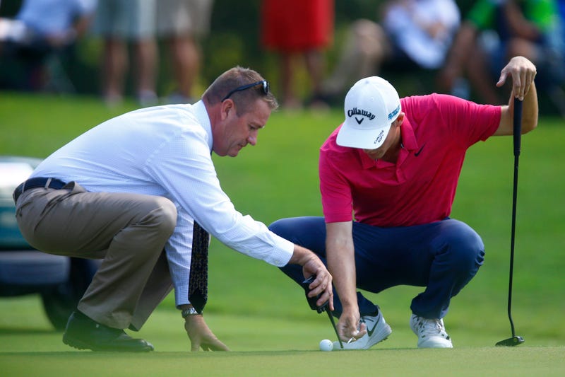 Aaron Wise gets a ruling from the official on the fifth hole during the second round of the Tour Championship