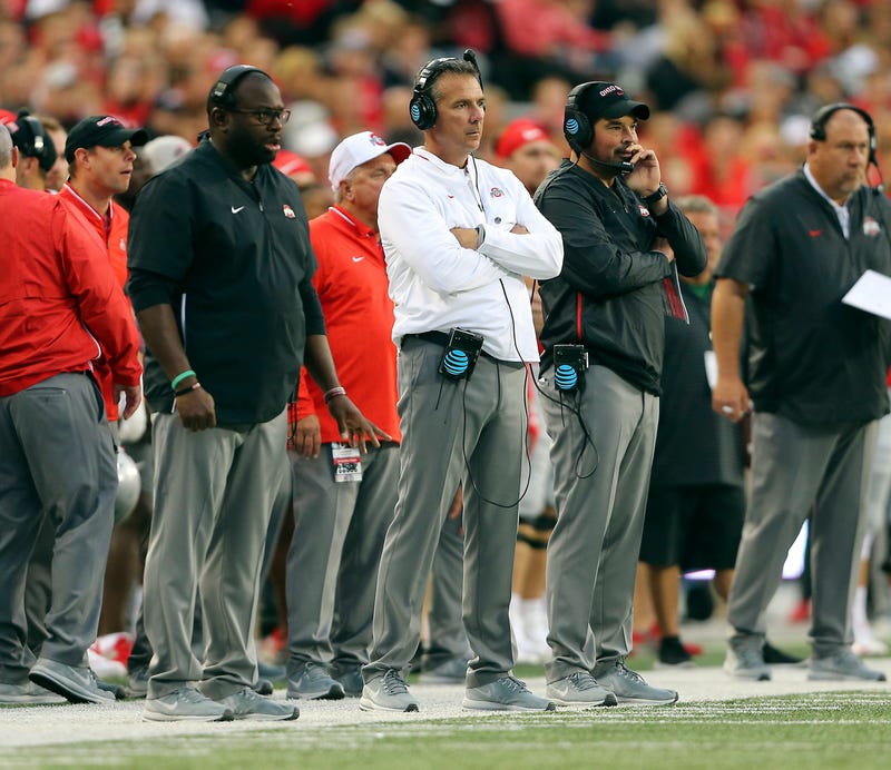 Ohio State Buckeyes head coach Urban Meyer (center) watches the game from the sidelines with assistant coach Ryan Day (right) and assistant coach Tony Alford (left) during the third quarter against the Ohio State Buckeyes at Ohio Stadium.