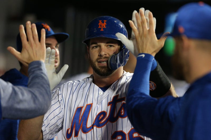 Sep 27, 2018; New York City, NY, USA; New York Mets catcher Kevin Plawecki (26) celebrates in the dugout with teammates after hitting a solo home run against the Atlanta Braves during the third inning at Citi Field. Mandatory Credit: Brad Penner-USA TODAY