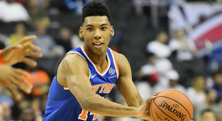 Allonzo Trier passes the ball against the Washington Wizards during the second quarter at Capital One Arena.