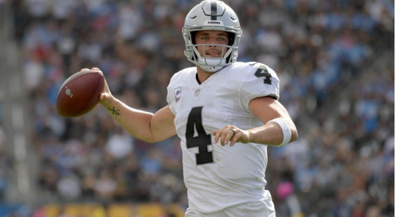 Derek Carr throws a a pass in the fourth quarter against the Los Angeles Chargers at StubHub Center.