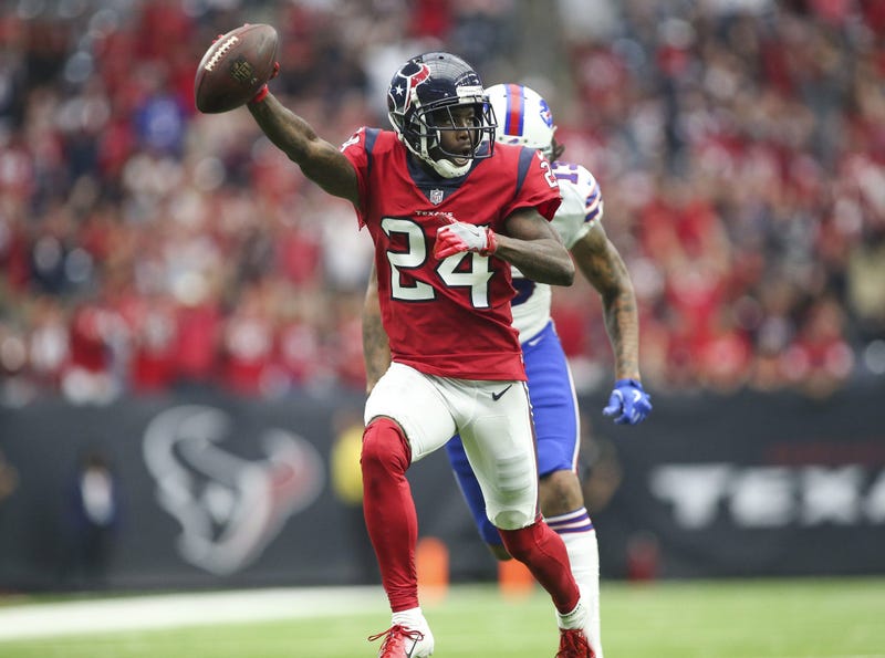 Oct 14, 2018; Houston, TX, USA; Houston Texans cornerback Johnathan Joseph (24) returns an interception for a touchdown against Buffalo Bills wide receiver Kelvin Benjamin (13) during the fourth quarter at NRG Stadium. Mandatory Credit: Troy Taormina-USA 