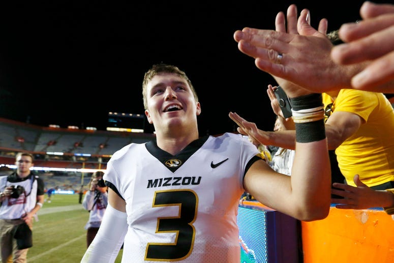 Nov 3, 2018; Gainesville, FL, USA; Missouri Tigers quarterback Drew Lock (3) celebrates with fans in the stands after defeating the Florida Gators at Ben Hill Griffin Stadium. Kim Klement-USA TODAY Sports