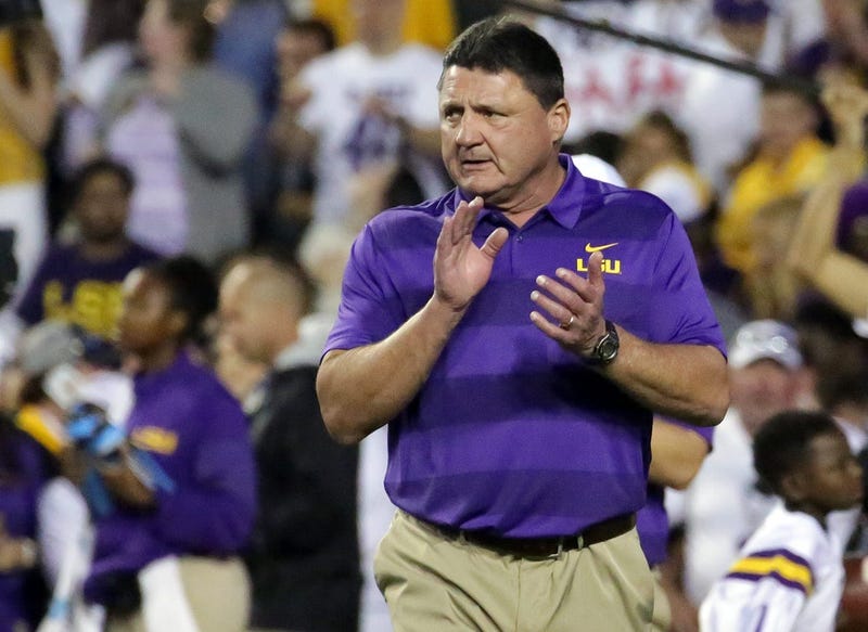 Nov 3, 2018; Baton Rouge, LA, USA; LSU Tigers head coach Ed Orgeron cheers on his players during warmup drills before their game against the Alabama Crimson Tide at Tiger Stadium.