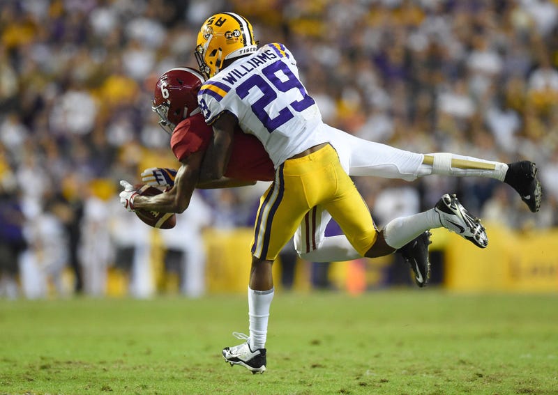LSU Tigers cornerback Greedy Williams (29) breaks up a pass intended for Alabama Crimson Tide wide receiver DeVonta Smith (6) during the third quarter at Tiger Stadium.