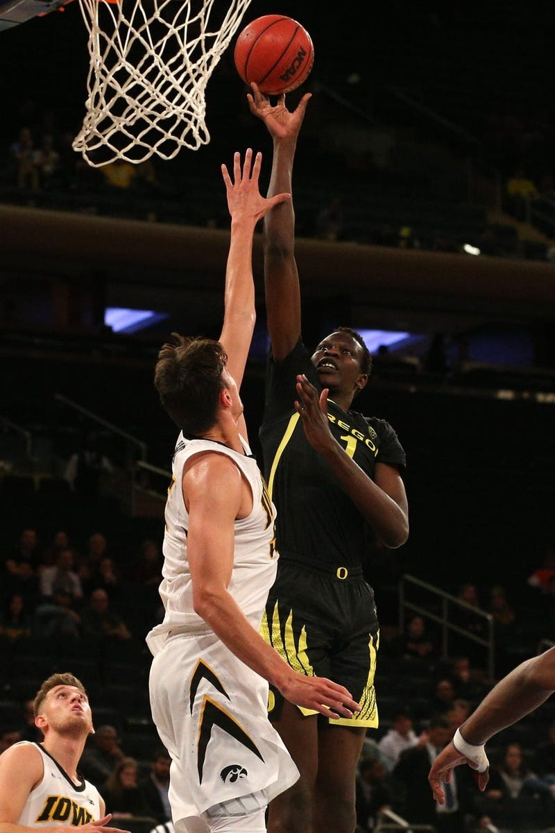 Oregon Ducks center Bol Bol (1) shoots against Iowa Hawkeyes forward Luka Garza (55) during the second half at Madison Square Garden.