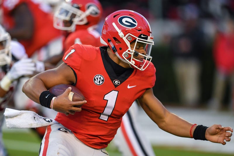  Georgia Bulldogs quarterback Justin Fields (1) runs for a touchdown against the Massachusetts Minutemen during the first half at Sanford Stadium.