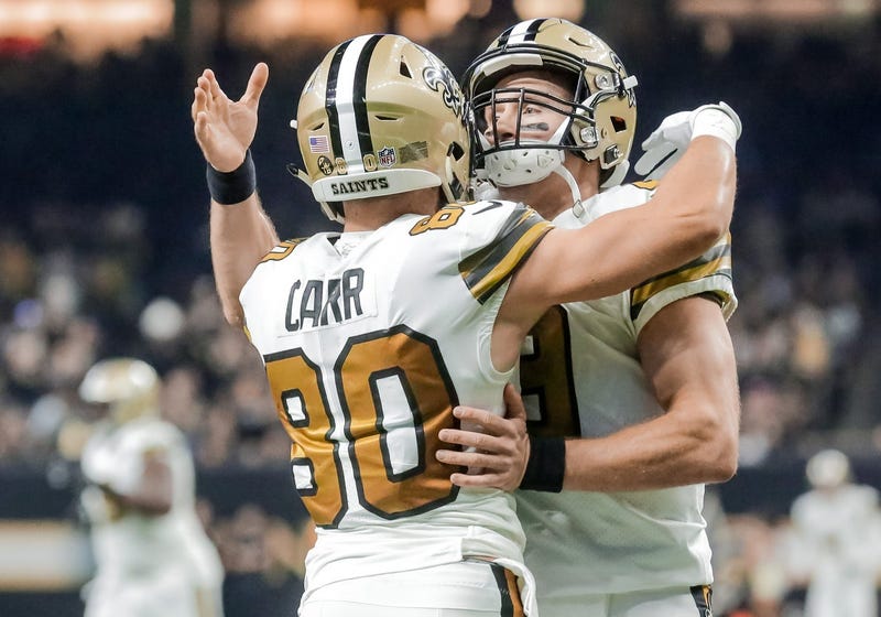 Nov 18, 2018; New Orleans, LA, USA; New Orleans Saints quarterback Drew Brees (9) celebrates with wide receiver Austin Carr (80) after a touchdown during the first quarter against the Philadelphia Eagles at the Mercedes-Benz Superdome.