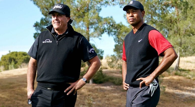 Phil Mickelson and Tiger Woods on the first tee during The Match: Tiger vs Phil golf match at Shadow Creek Golf Course.