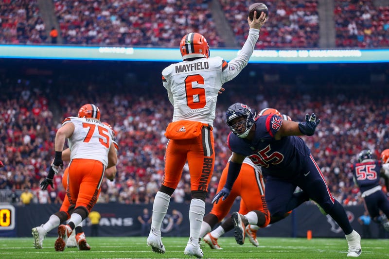Dec 2, 2018; Houston, TX, USA; Cleveland Browns quarterback Baker Mayfield (6) throws a pass while being pursued by Houston Texans defensive end Christian Covington (95) during the fourth quarter at NRG Stadium. Mandatory Credit: John Glaser-USA TODAY Spo