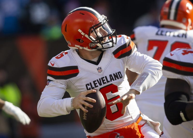 Cleveland Browns quarterback Baker Mayfield (6) throws a pass for a first down against the Carolina Panthers during the first quarter at FirstEnergy Stadium.