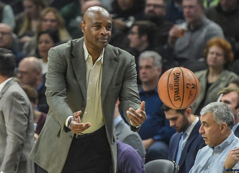 Dec 10, 2018; Milwaukee, WI, USA; Cleveland Cavaliers head coach Larry Drew tosses the ball back in play in the first quarter during the game against the Milwaukee Bucks at the Fiserv Forum. Mandatory Credit: Benny Sieu-USA TODAY Sports